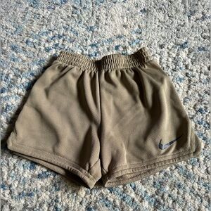 Tan Nike mesh shorts. Size 3T.